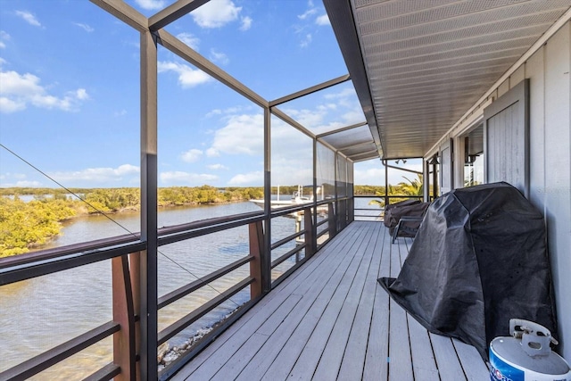 wooden deck featuring a water view