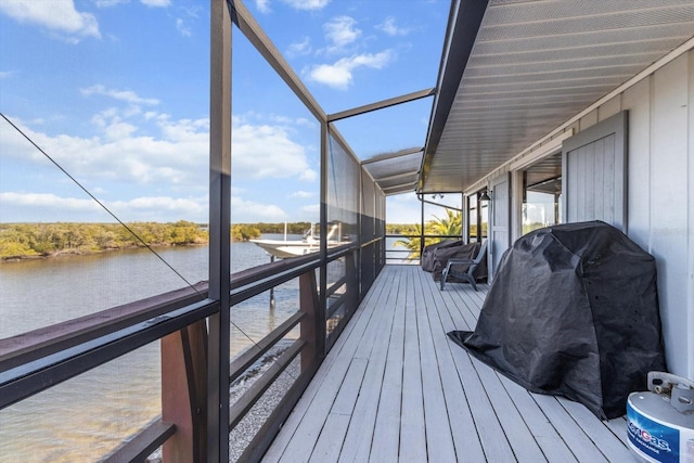 wooden deck featuring a water view