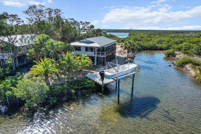 view of dock with a water view and boat lift