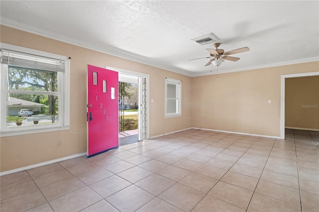 foyer entrance featuring light tile patterned floors, ceiling fan, visible vents, and crown molding