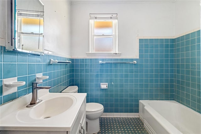 full bathroom with toilet, tile walls, vanity, tile patterned floors, and a tub