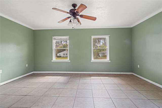 unfurnished room with baseboards, ornamental molding, ceiling fan, and light tile patterned flooring