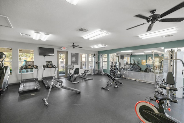 exercise room with a healthy amount of sunlight and visible vents