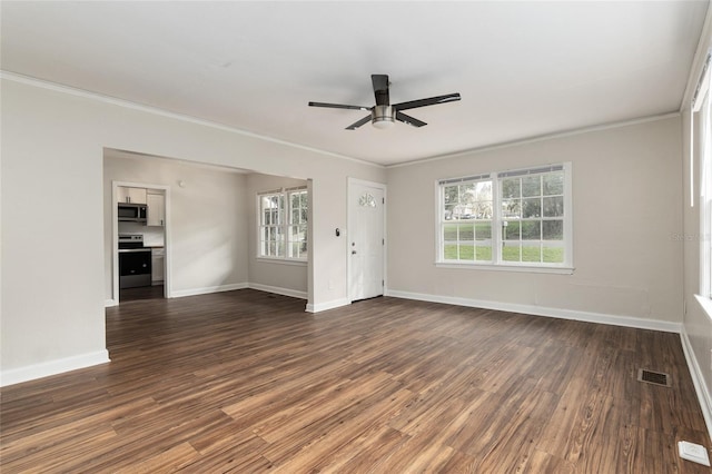 empty room with dark wood-style flooring, visible vents, and crown molding