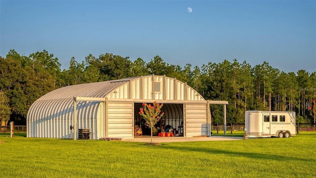 view of pole building with a yard