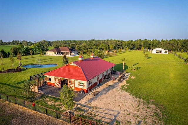 drone / aerial view with a water view and a rural view