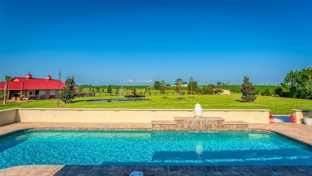 pool with a lawn and a patio