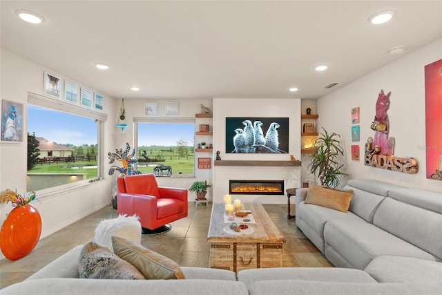 3550 SE 165th Ave, Morriston, FL 32668 - tiled living area with recessed lighting and a glass covered fireplace