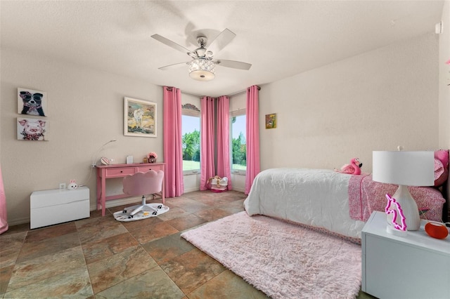 3550 SE 165th Ave, Morriston, FL 32668 - bedroom with stone finish floors and ceiling fan