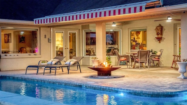 3550 SE 165th Ave, Morriston, FL 32668 - swimming pool featuring a fire pit, a patio area, and french doors
