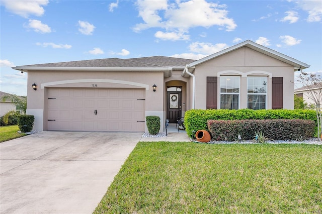 ranch-style house with driveway, a garage, a front lawn, and stucco siding