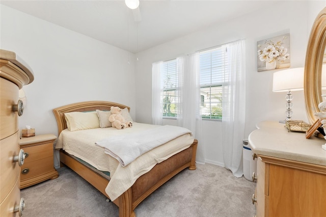 bedroom featuring light carpet