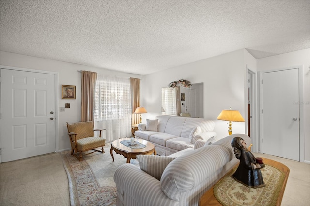 living room featuring a textured ceiling and light carpet