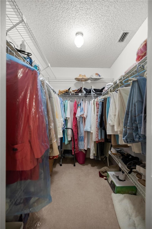 spacious closet featuring carpet and visible vents