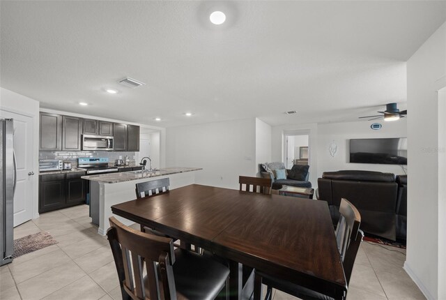 dining space featuring a ceiling fan, light tile patterned flooring, visible vents, and recessed lighting