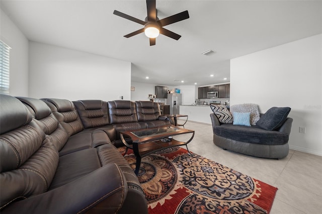 living area with a ceiling fan, recessed lighting, visible vents, and light tile patterned floors