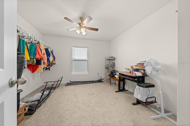 interior space featuring baseboards and a ceiling fan