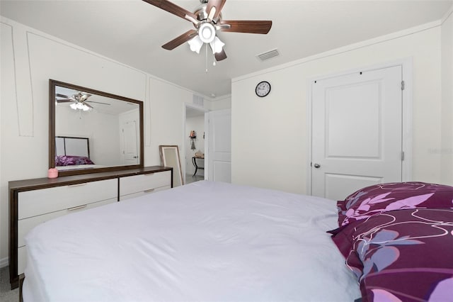 bedroom featuring crown molding, visible vents, and a ceiling fan