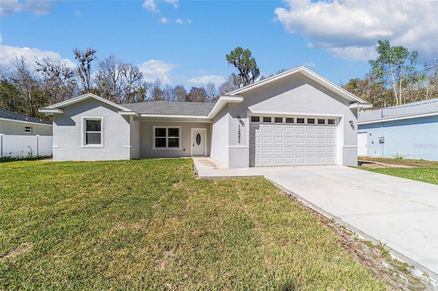 single story home with an attached garage, driveway, a front yard, and stucco siding