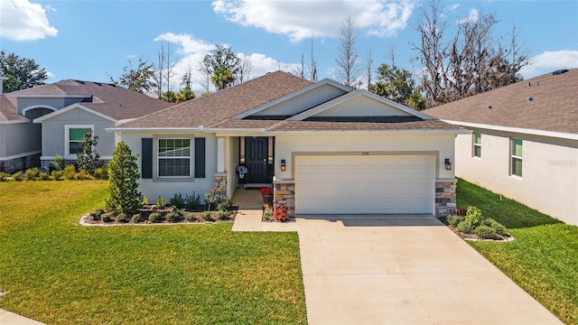 view of front of house featuring an attached garage, a front lawn, concrete driveway, and stucco siding