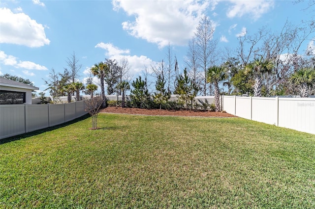 view of yard with a fenced backyard