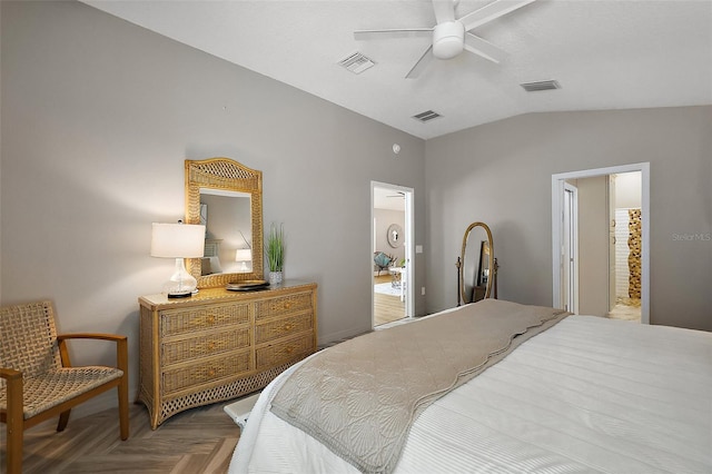 bedroom featuring vaulted ceiling, visible vents, and a ceiling fan