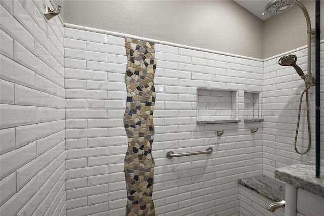 full bath featuring a tile shower