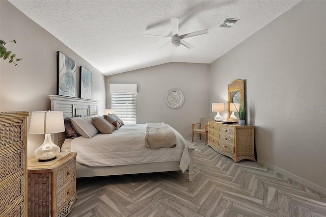 bedroom featuring lofted ceiling, ceiling fan, a textured ceiling, visible vents, and baseboards