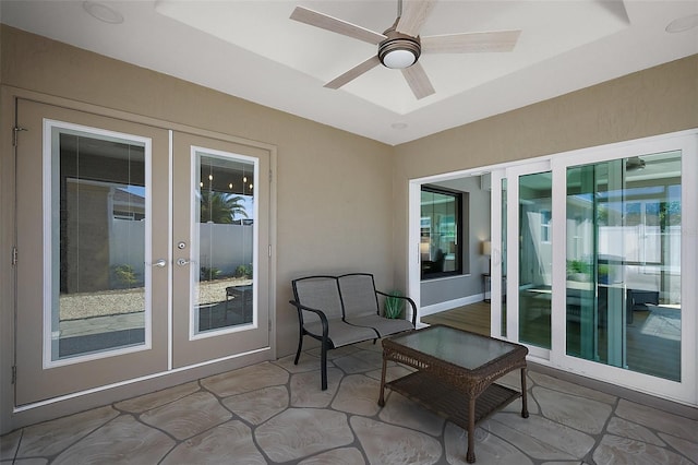 view of patio featuring a ceiling fan and french doors