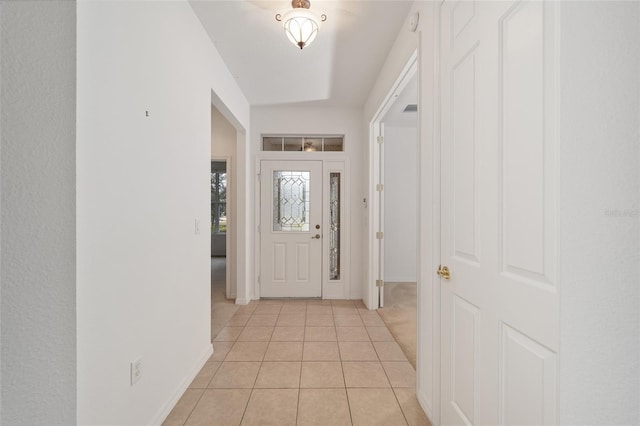 entrance foyer with visible vents, baseboards, and light tile patterned flooring