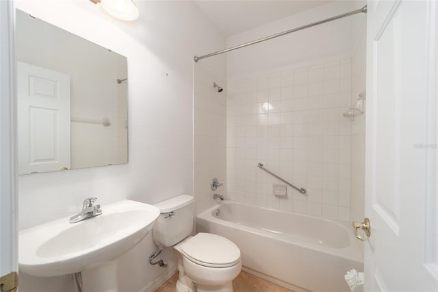 bathroom featuring shower / bath combination, a sink, and toilet