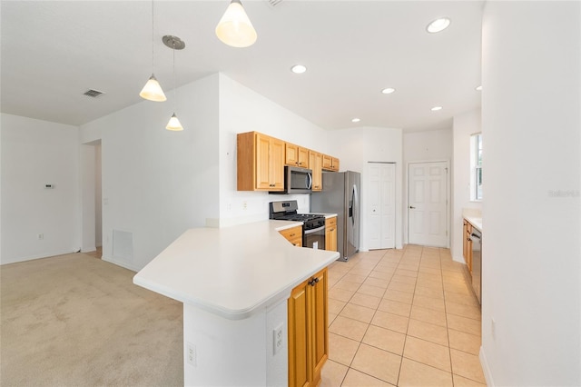 8669 SW 88th Loop, Ocala, FL 34481 - kitchen featuring appliances with stainless steel finishes, light countertops, a peninsula, recessed lighting, and hanging light fixtures