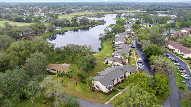 bird's eye view featuring a residential view and a water view