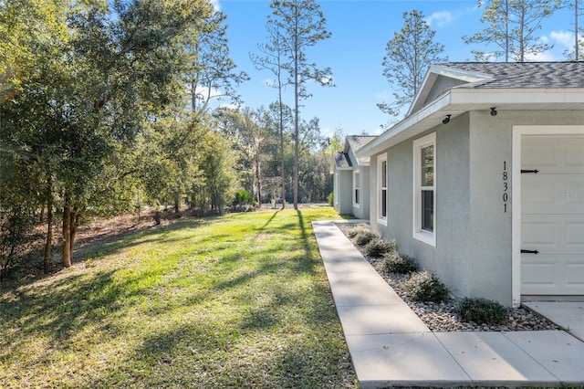 view of yard featuring a garage