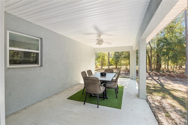 view of patio / terrace with outdoor dining area and a ceiling fan