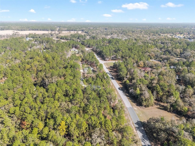 bird's eye view featuring a forest view