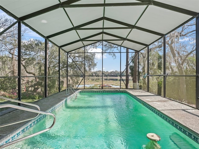 pool with a lanai and a patio area