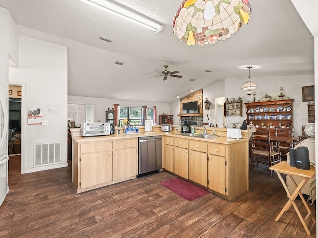 kitchen featuring light countertops, visible vents, dishwasher, and light brown cabinets