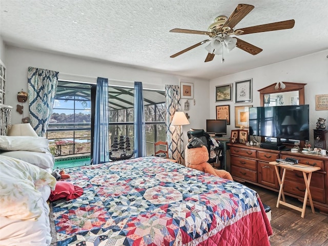 bedroom with a textured ceiling, wood finished floors, a ceiling fan, and access to exterior