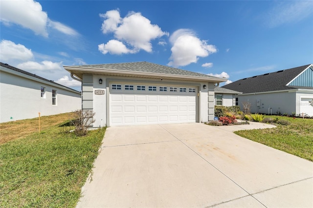 view of front of house with driveway, a front lawn, and stucco siding