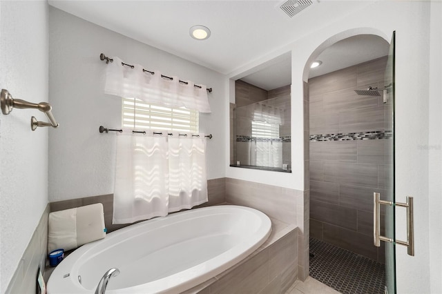 bathroom featuring a stall shower, visible vents, recessed lighting, and a bath