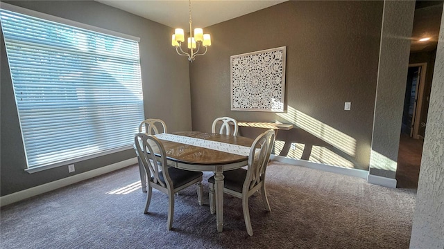 dining area with carpet, baseboards, and an inviting chandelier