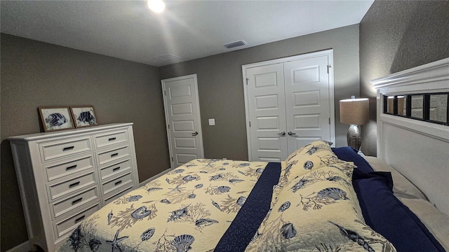 bedroom featuring a closet and visible vents