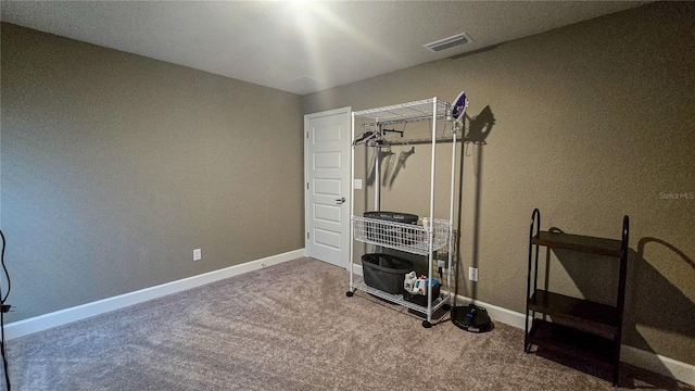 workout room featuring carpet, baseboards, and visible vents