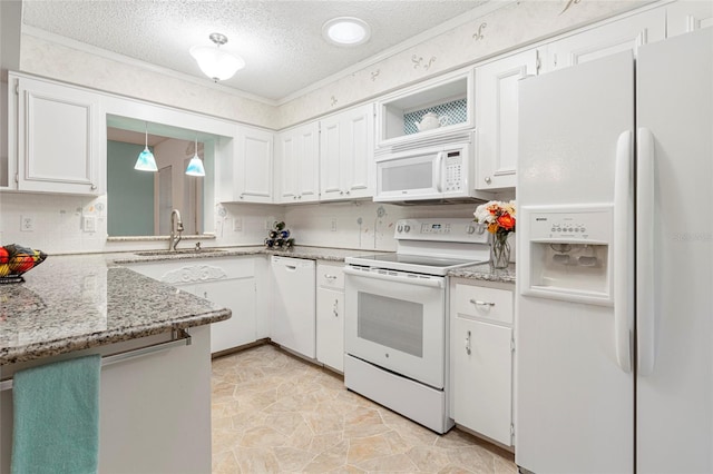 kitchen featuring hanging light fixtures, white cabinets, a sink, a textured ceiling, and white appliances