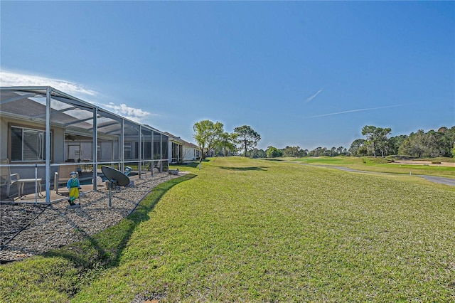 view of yard featuring a lanai and a swimming pool