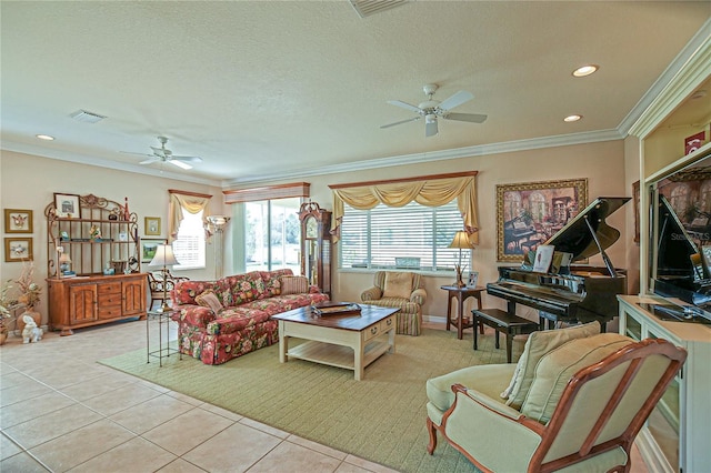 tiled living area with a textured ceiling, a ceiling fan, visible vents, and crown molding