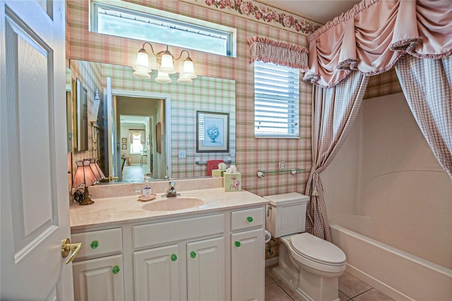 bathroom featuring toilet, wallpapered walls, vanity, and tile patterned floors