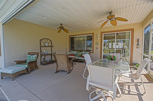 view of patio / terrace with a ceiling fan, outdoor dining area, and an outdoor living space