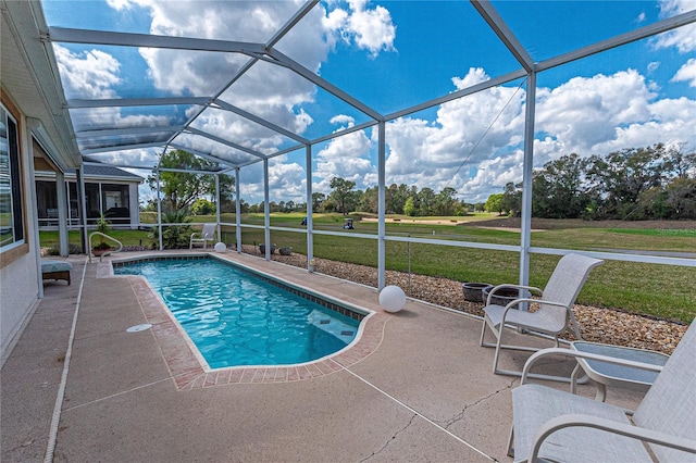 outdoor pool with a patio, a lawn, and a lanai